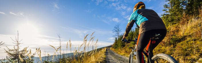Woman mountain biking in Brighton, Utah