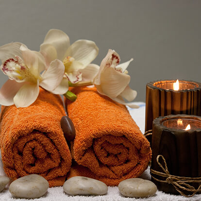 Massage Therapy Candles, Towels and Stones