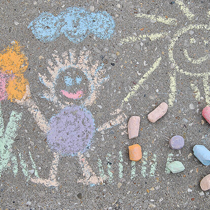 Chalk drawing on pavement by child